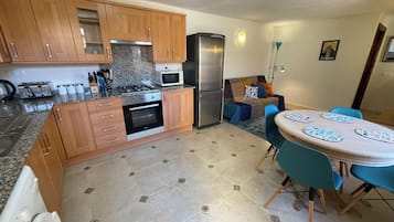Superior Apartment, Courtyard View | Private kitchen | Fridge, microwave