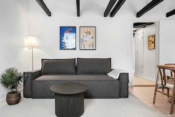 Dining and living room. Dining table equipped with 8 seats to ensure the full party can dine together. Living area also equipped with very comfortable sleeping sofa, that sleeps 2 guests. Blackout curtains on all windows.