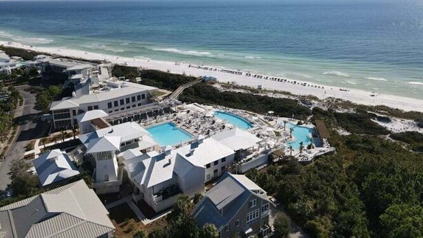 A resort with multiple buildings, a large pool area, and a beach view. - Newly Remodeled | Watercolor Resort | Golf Cart! (Santa Rosa Beach)