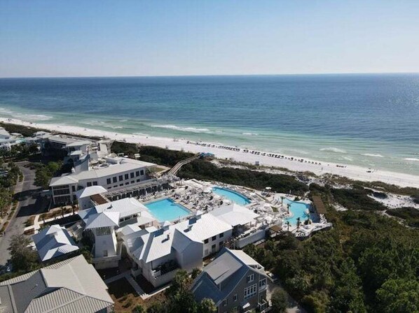 A resort with multiple buildings, a large pool area, and a beach view. - Newly Remodeled | Watercolor Resort | Golf Cart! (Santa Rosa Beach)