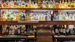 A bar with multiple shelves of various liquor bottles. - Bein Inn hotel  (Perth)