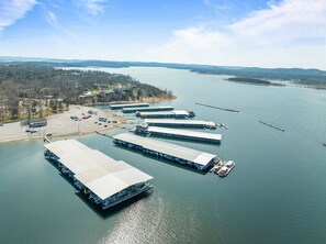 A large waterfront facility with multiple docks and a parking area.
