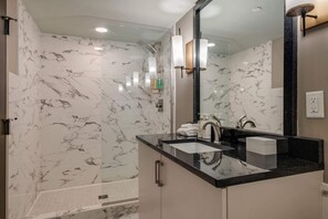 Shower, hair dryer, towels, shampoo