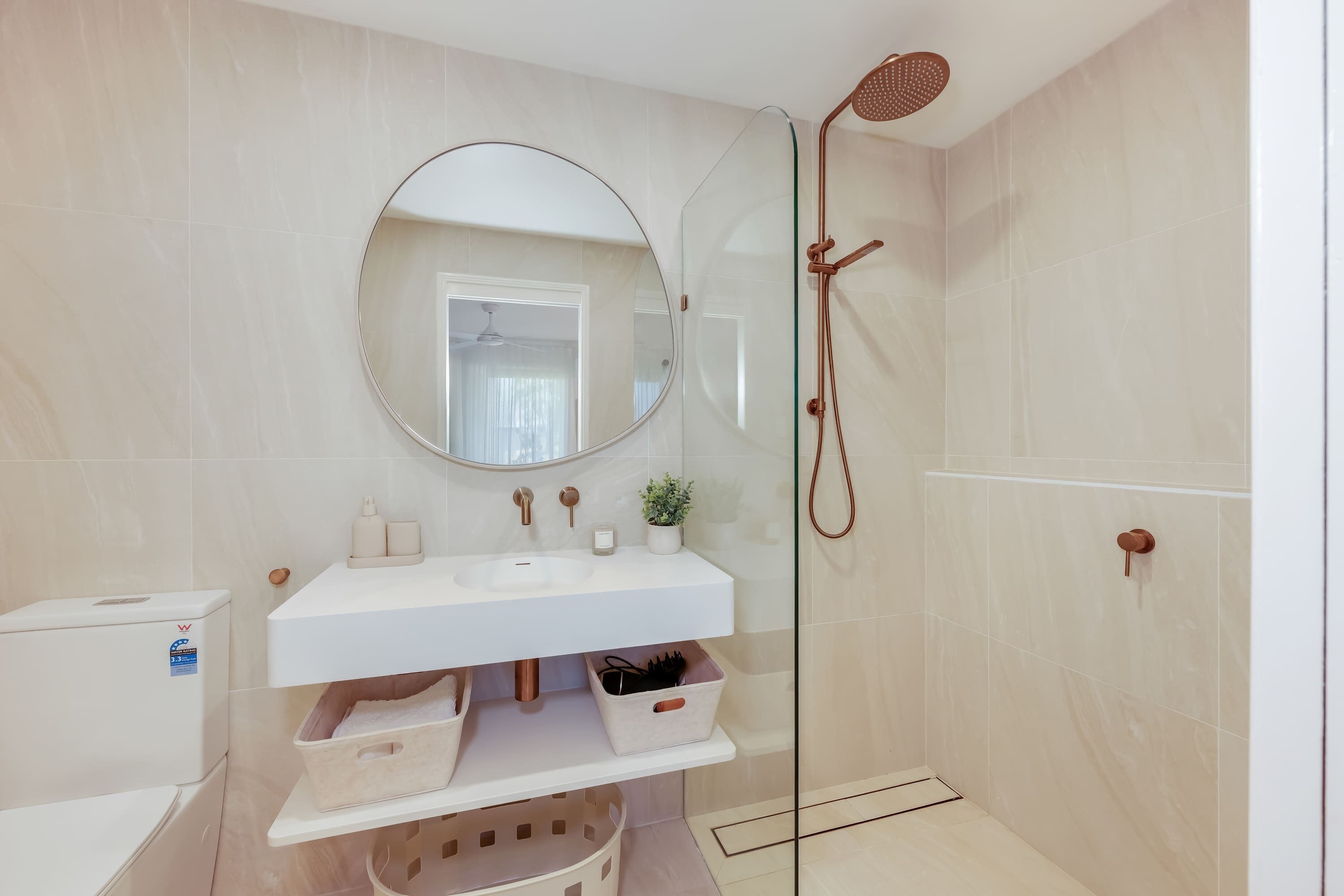 Walk-in shower with brass rainfall shower head
