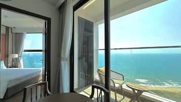 Family Suite, 2 Bedrooms, Beach View, Sea Facing | Living area | 65-inch Smart TV with cable channels
