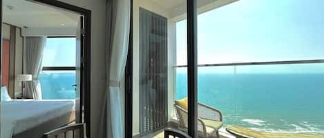 Family Suite, 2 Bedrooms, Beach View, Sea Facing | Living area | 65-inch Smart TV with cable channels