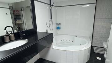 Jetted bath, towels, soap, toilet paper