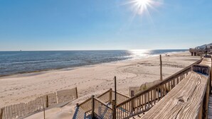 A beach with wooden boardwalks and a clear view of the ocean. - "Wahoo" Gulf Beachfront, 4 Bedroom/4 Bath, Sleeps 14, Pet Friendly, Cargo Lift (Dauphin Island)