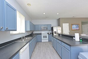 Fridge, microwave, oven, stovetop - Charming house in serene Davenport with AC/New Floor/New Bathrooms/New Kitchen (Davenport)