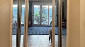 A hallway leading to a balcony with a view of the outdoors. - 2 Bedroom Condo -Views of West Point and Hudson River, steps from Metro North! (Garrison)