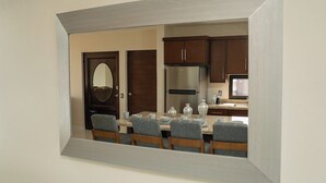 A compact kitchen with dark wooden cabinets, a stainless steel refrigerator, and a microwave. - Apartment for 8 with terrace and BBQ in the city center (Arandas)