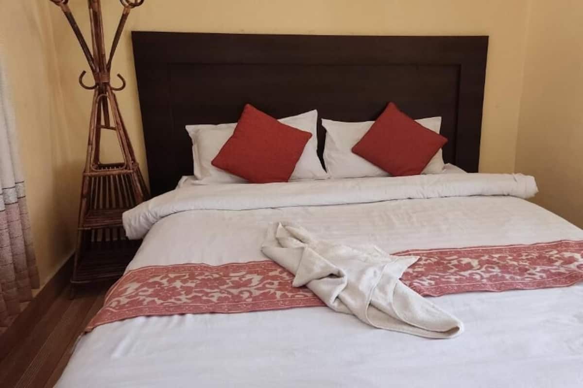 Desk, laptop workspace, bed sheets