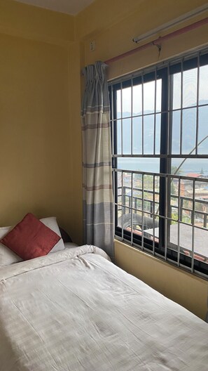 Comfort Twin Room, Balcony, Lake View | Desk, laptop workspace, bed sheets - Jungle front lodge (Pokhara)