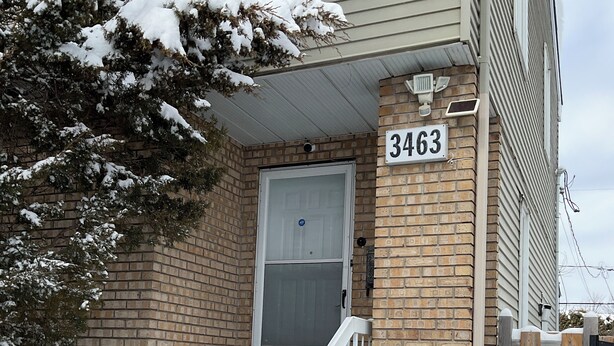 A brick house with a white door and steps leading up to the entrance. - Family-Friendlyin QuietLaval Neighborhood (Laval)