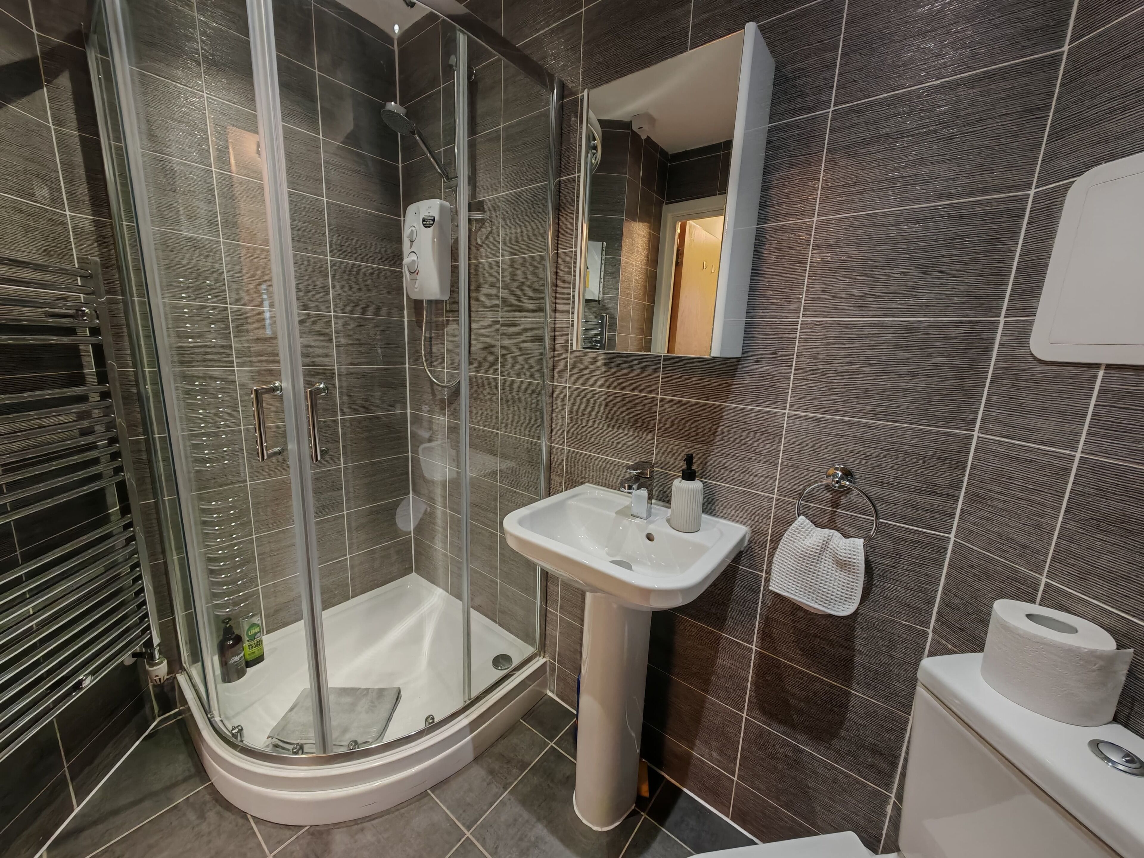 Shower, hair dryer, towels, soap