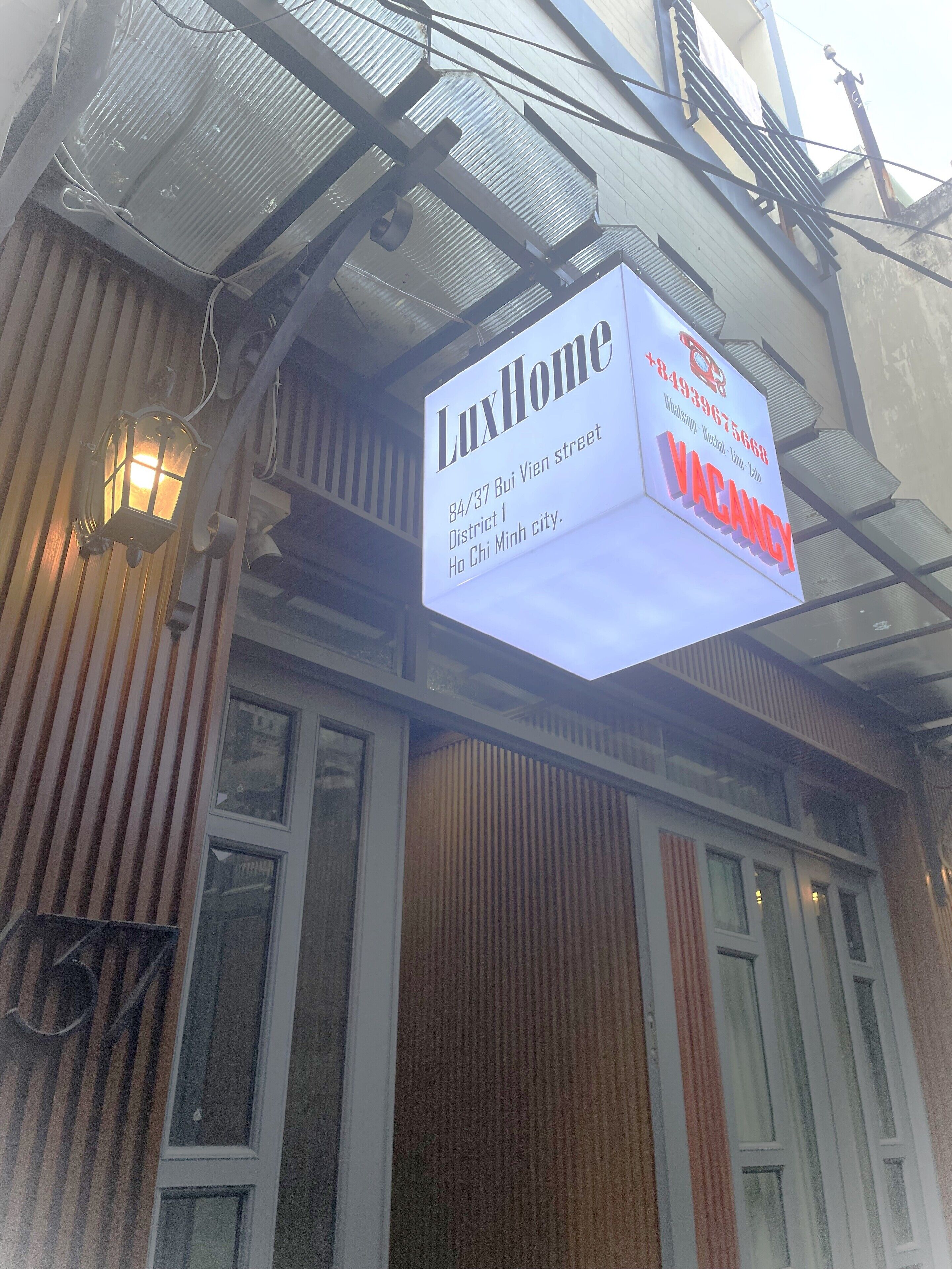A signboard advertising a vacant property at 84/37 Bui Vien street, District 1, Ho Chi Minh city.