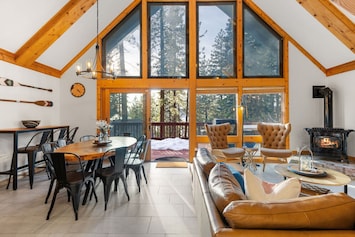 Open living space with floor to ceiling windows.