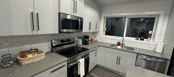 Brand New Home, clean and organize, close to airport and all amenities.