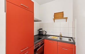 Fridge, stovetop, dishwasher, coffee/tea maker