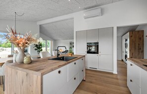 Fridge, stovetop, dishwasher, coffee/tea maker