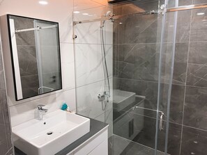 Shower, towels, soap, toilet paper