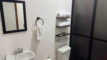 Separate tub and shower, rainfall showerhead, towels, soap