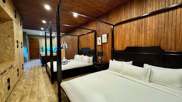 Family Suite, Balcony, Garden View | In-room safe, desk, laptop workspace, iron/ironing board