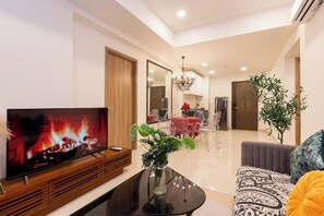Deluxe Apartment, 3 Bedrooms, Balcony, City View | Living area | Smart TV - SOHO Premier Residence (Ho Chi Minh City)