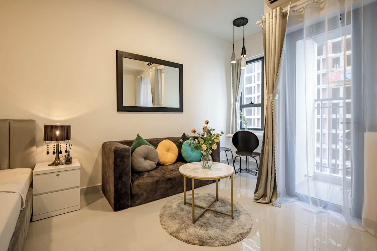 Deluxe Apartment, 1 Bedroom, Balcony, City View | Living area | Smart TV