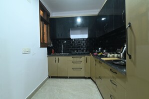 Deluxe-Apartment, Balkon, Gartenblick | Eigene Küche