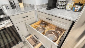 A kitchen with a drawer organizer containing pots and pans. - Remodeled, Washer, Dryer, Mins to Beach & Downtown (Michigan City)