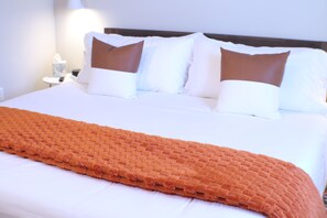 1 bedroom, desk, iron/ironing board, travel crib