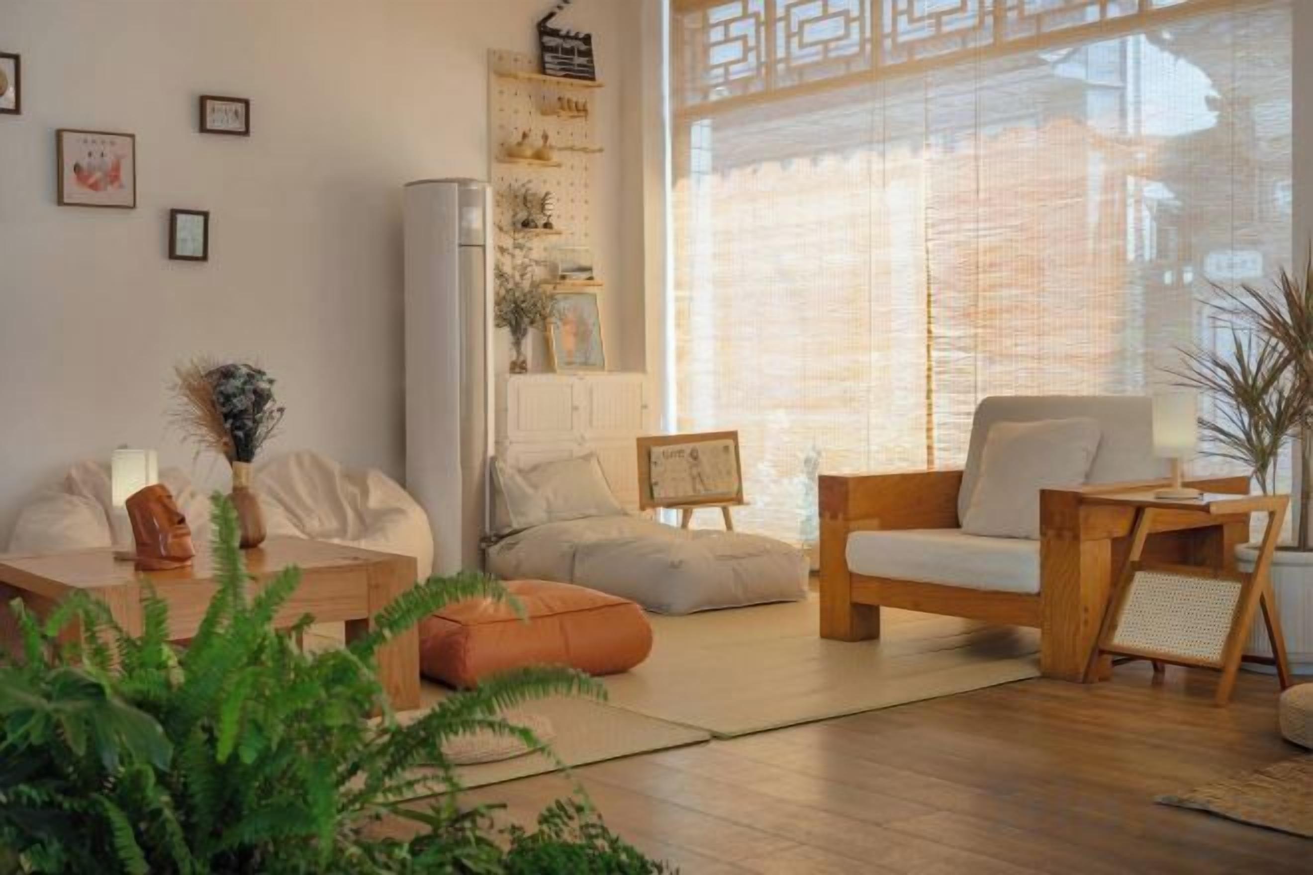 A modern living room with a sofa, armchair, and coffee table.