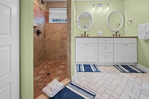 Shower, hair dryer, towels, toilet paper