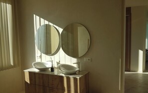 Shower, hair dryer, towels, toilet paper
