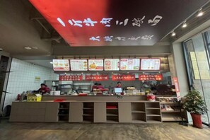 A food counter with multiple menu boards and a digital display above. - Fudimen Hotel (Zhenjiang High-speed Railway Station) (Zhenjiang)