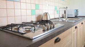 Apartment, City View | Private kitchen | Full-size fridge, highchair