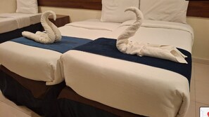 Standard Quadruple Room, City View | Minibar, in-room safe, blackout curtains, soundproofing - Rafaheyat Alsetten Hotel (Makkah)