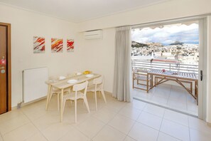 Family Apartment, 2 Bedrooms, Kitchen, Mountain View | Living area | 55-inch Smart TV with digital channels