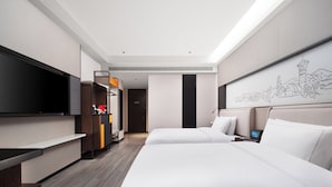 A modern hotel room with two beds, a flat-screen TV, a desk, and a large window. - UrCove by Hyatt Aksu Century Square (Aksu)