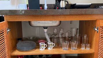 Fridge, coffee/tea maker, cookware/dishes/utensils