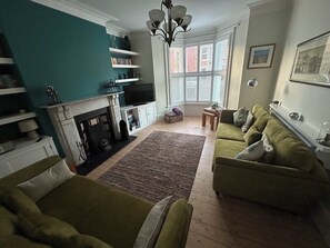 Smart TV, fireplace, books