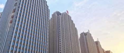 A row of tall buildings with a clear sky.