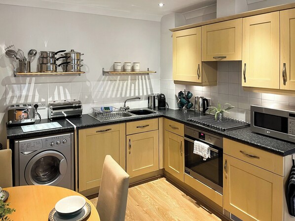 Dishwasher, high chair, cookware/dishes/utensils