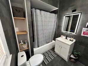 Bidet, towels, soap, toilet paper