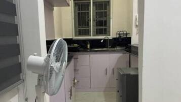 Fridge, electric kettle, cookware/dishes/utensils