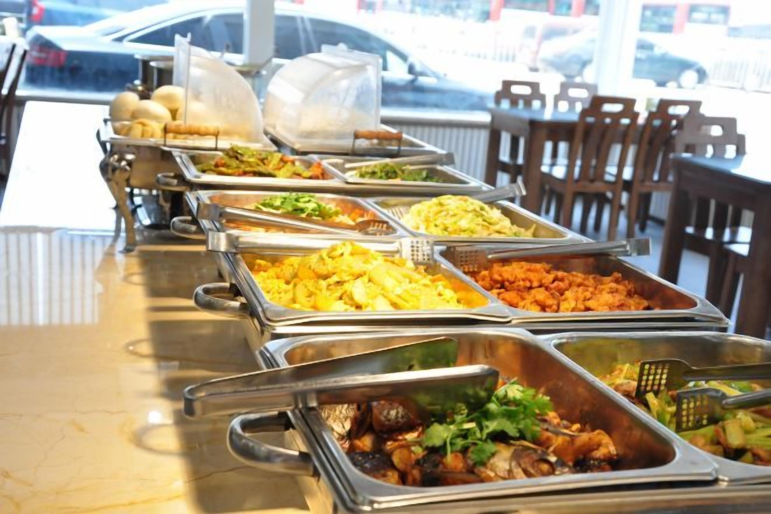 A buffet with multiple food stations.