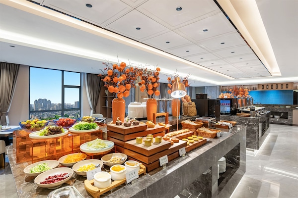 Desayuno con opciones de la cocina local diario (CNY 28 por persona)