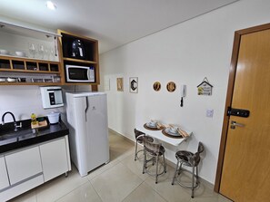 Fridge, microwave, stovetop, coffee/tea maker