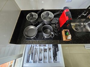 Fridge, microwave, stovetop, coffee/tea maker